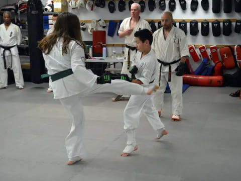 a group of people in karate uniforms