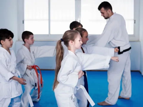 a group of people in karate uniforms