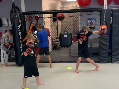 a group of kids playing with a ball in a gym