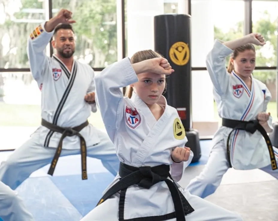 a group of people in karate uniforms