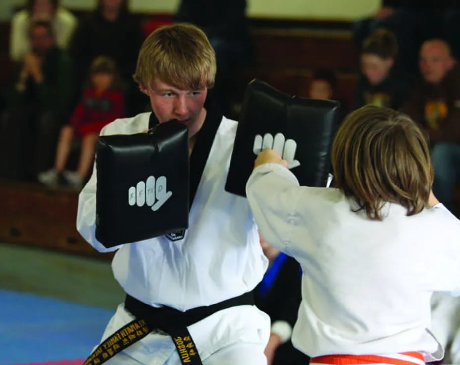 a man and woman in a boxing ring
