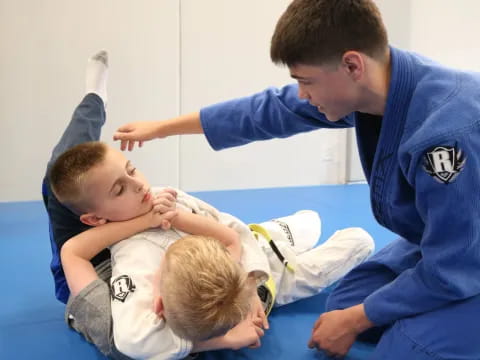 a man and a boy looking at a baby