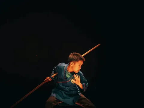 a boy holding a baseball bat