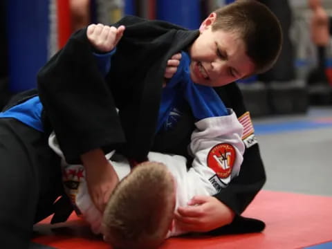a boy holding a ball