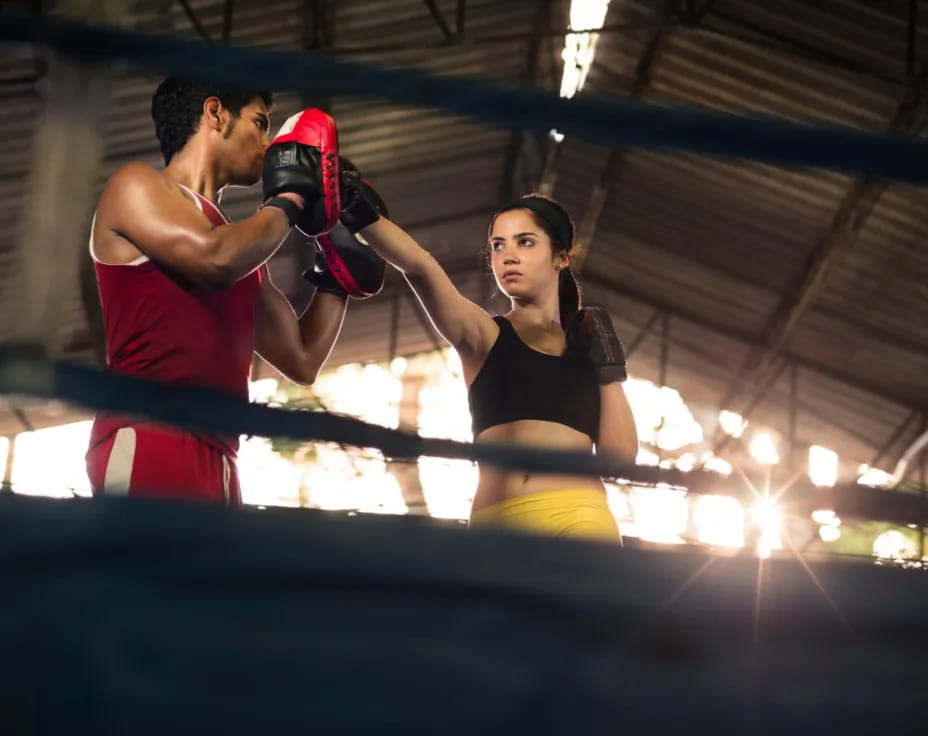 a man and woman boxing