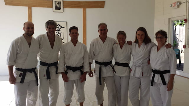 a group of people in white uniforms