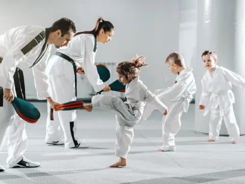 a group of people in karate uniforms