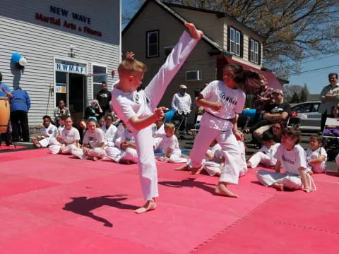 two children in karate uniforms