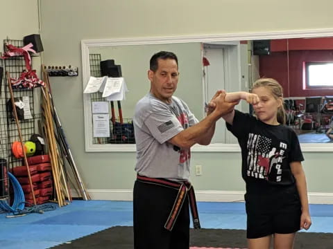 a man and a woman in a gym