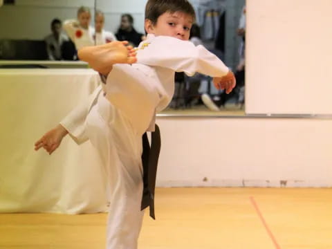 a boy in a karate uniform