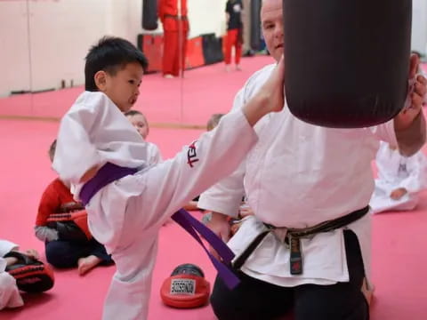 a group of people in karate uniforms