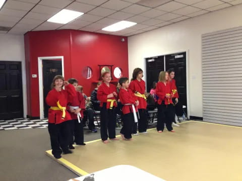 a group of people in red uniforms