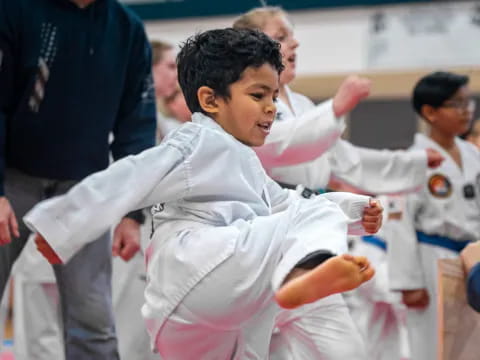 a boy in a karate uniform