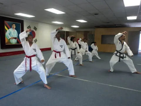 a group of people in karate uniforms