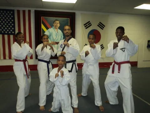 a group of people in karate uniforms