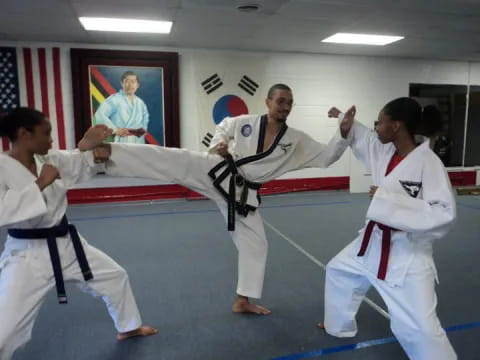 a group of people in karate uniforms