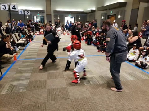 a person and a child in a gym