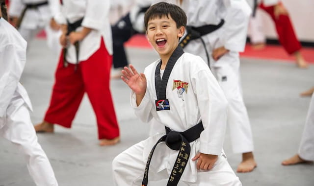 a boy in karate uniform