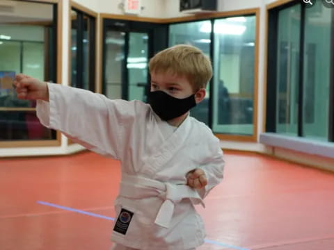 a boy in a karate uniform