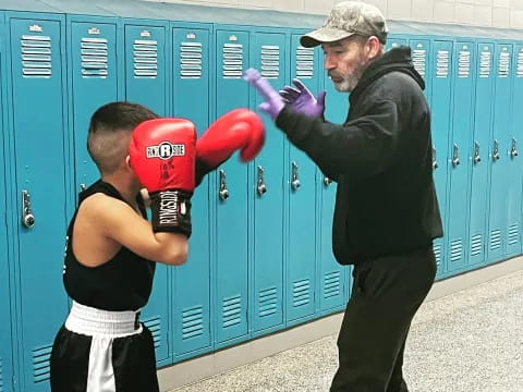 a man wearing boxing gloves