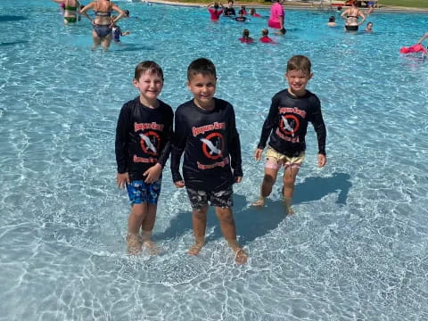 a group of boys in the water