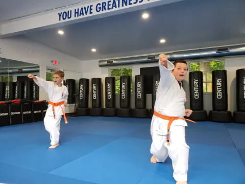 a couple of men in karate uniforms