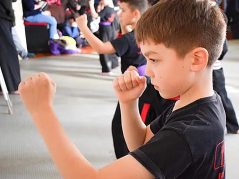 a boy holding a toothbrush