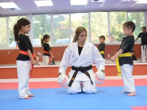 a group of children practicing martial arts