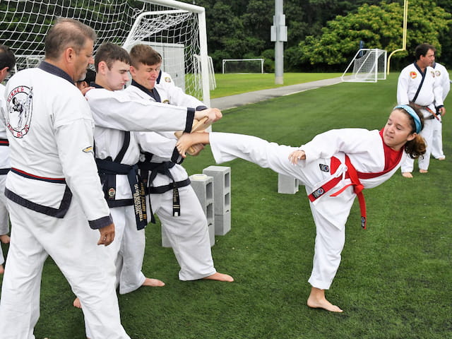 a group of people in karate uniforms