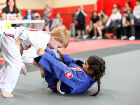 a couple of people in a karate uniform