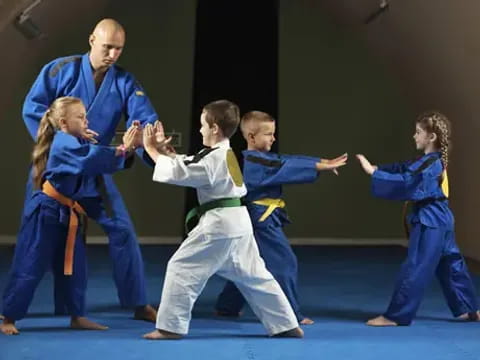 a group of people in karate uniforms