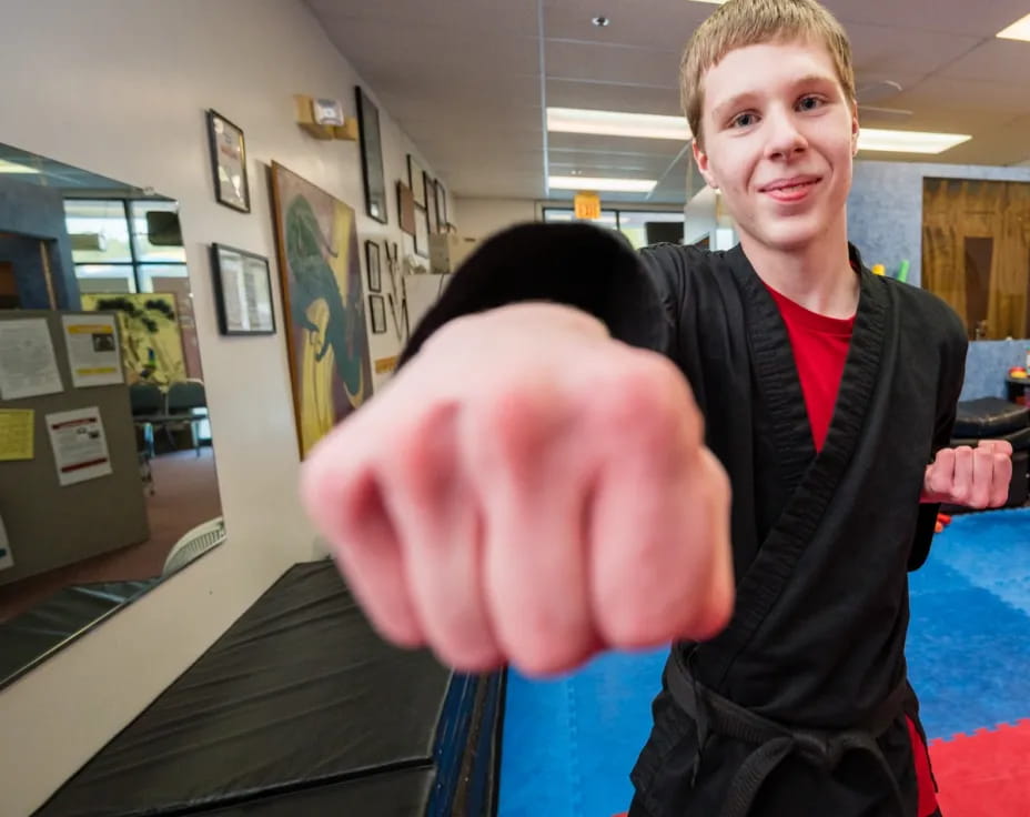 a person holding a large pink heart