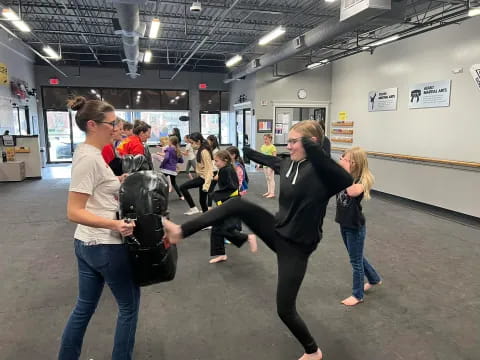 a group of people dancing in a room