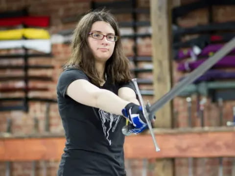 a woman holding a sword