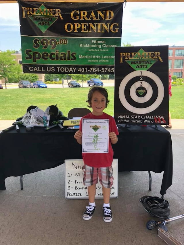 a boy holding a sign