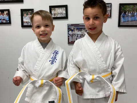 two boys wearing karate uniforms