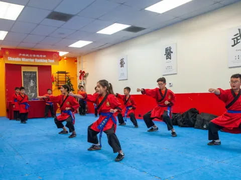 a group of people in red uniforms