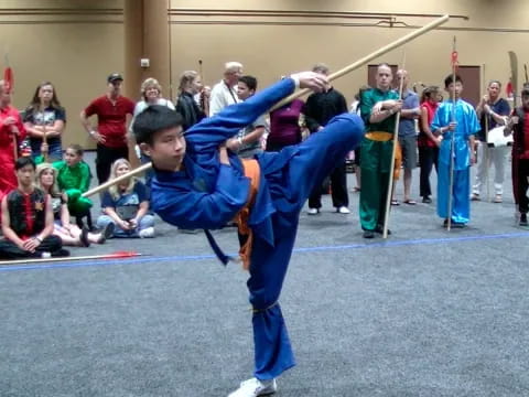 a person in blue karate uniform