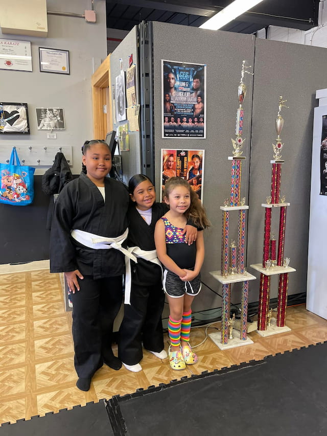 a person and two girls posing for a picture