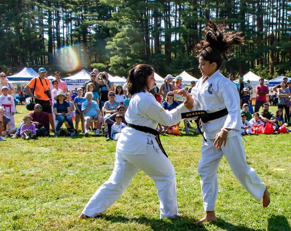 two people in white karate uniforms