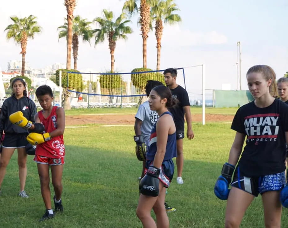 a group of kids playing football