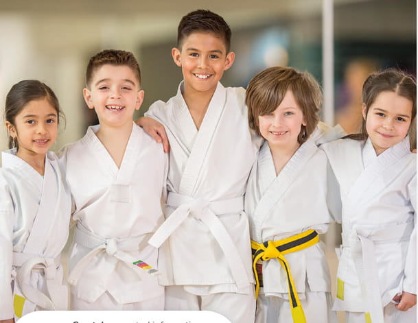 a group of children wearing white lab coats