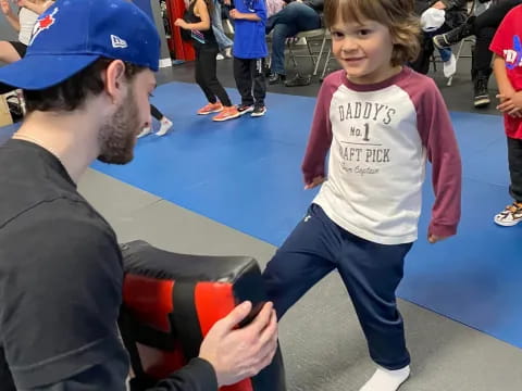 a person and a child dancing