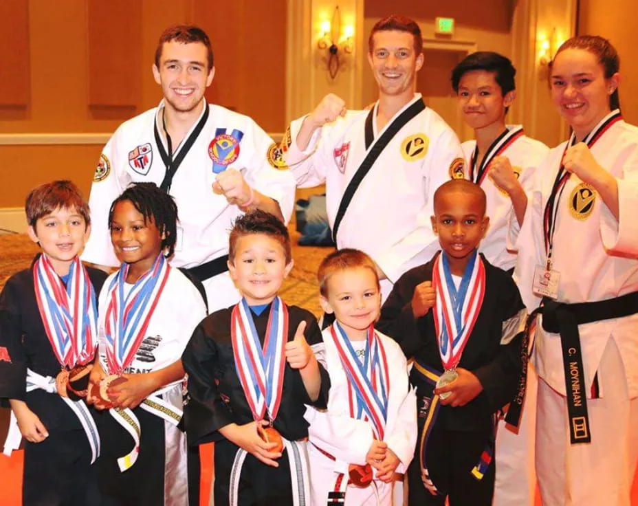 a group of people wearing medals