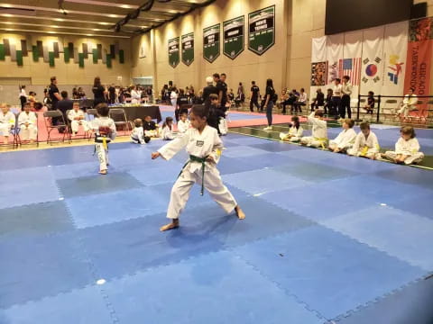 a group of people in a karate class