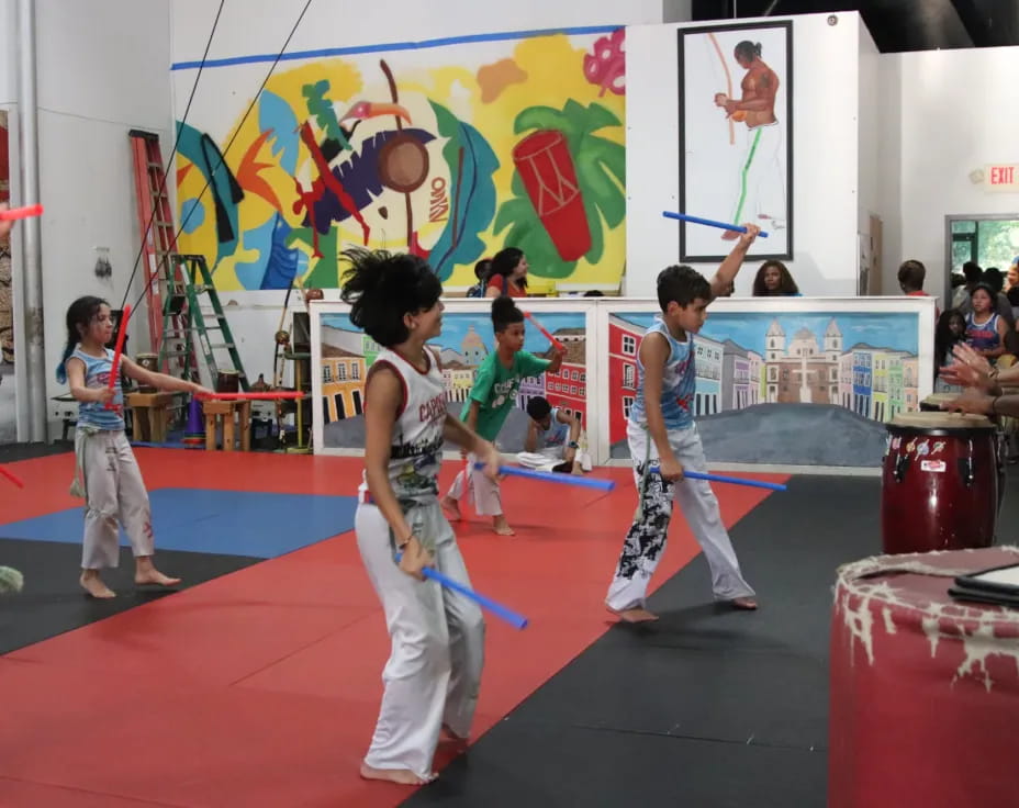a group of kids playing martial arts
