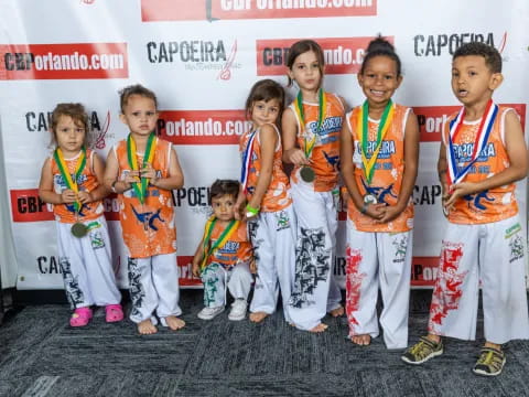 a group of kids wearing medals