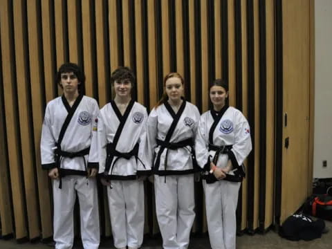 a group of men in karate uniforms