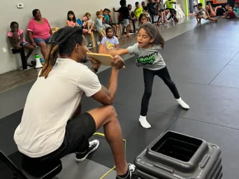 a woman lifting a girl up