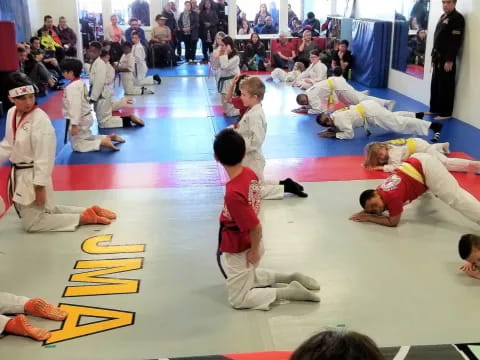 a group of people in karate uniforms